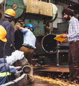 worman working with metal